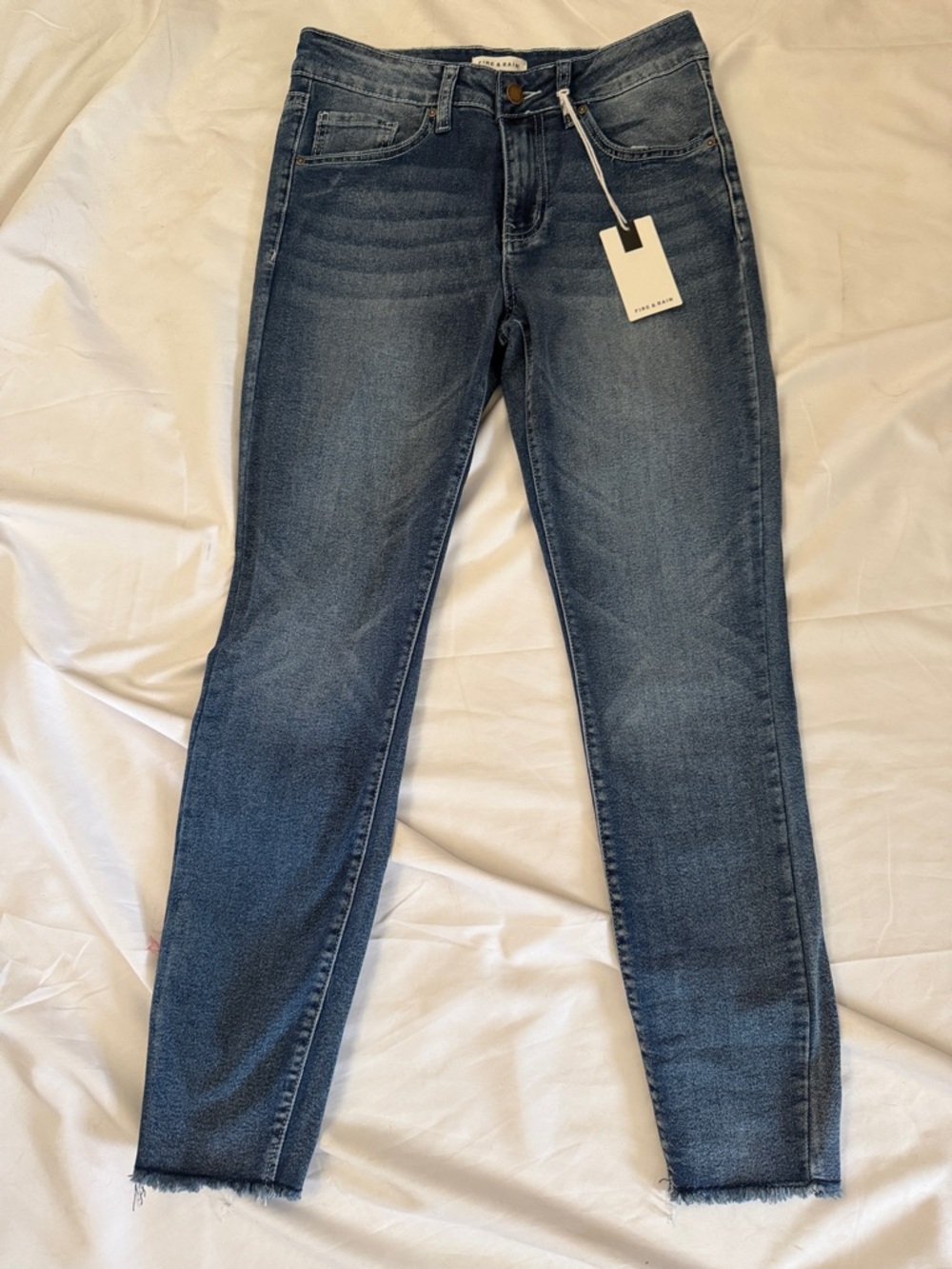 Women's Washed Blue Skinny Jeans with Frayed Hem